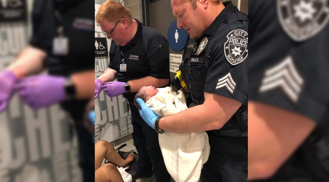 Officers help a woman deliver a newborn baby at McDonald’s