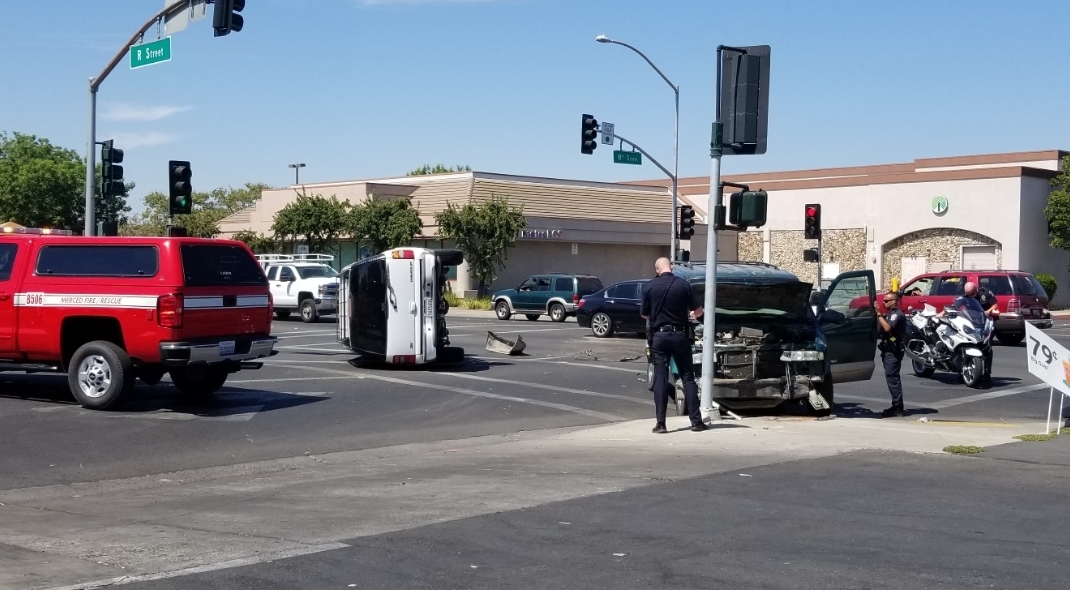 Two-vehicle collision causes rollover in Merced Busy street