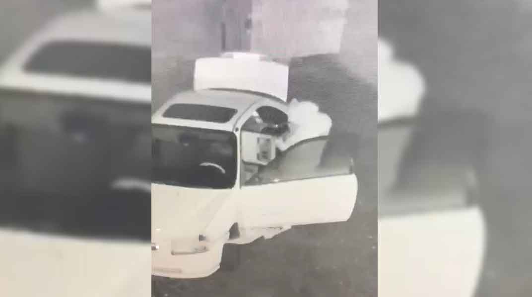 Two individuals caught on video breaking into Merced Business