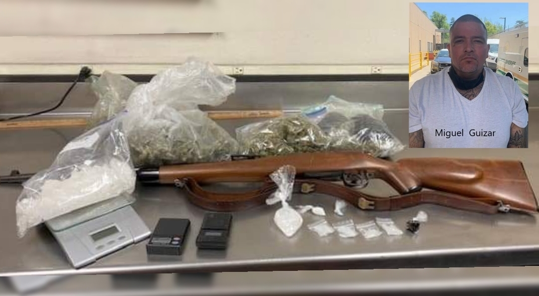 Gang member arrested after officers locate rifle and several narcotics